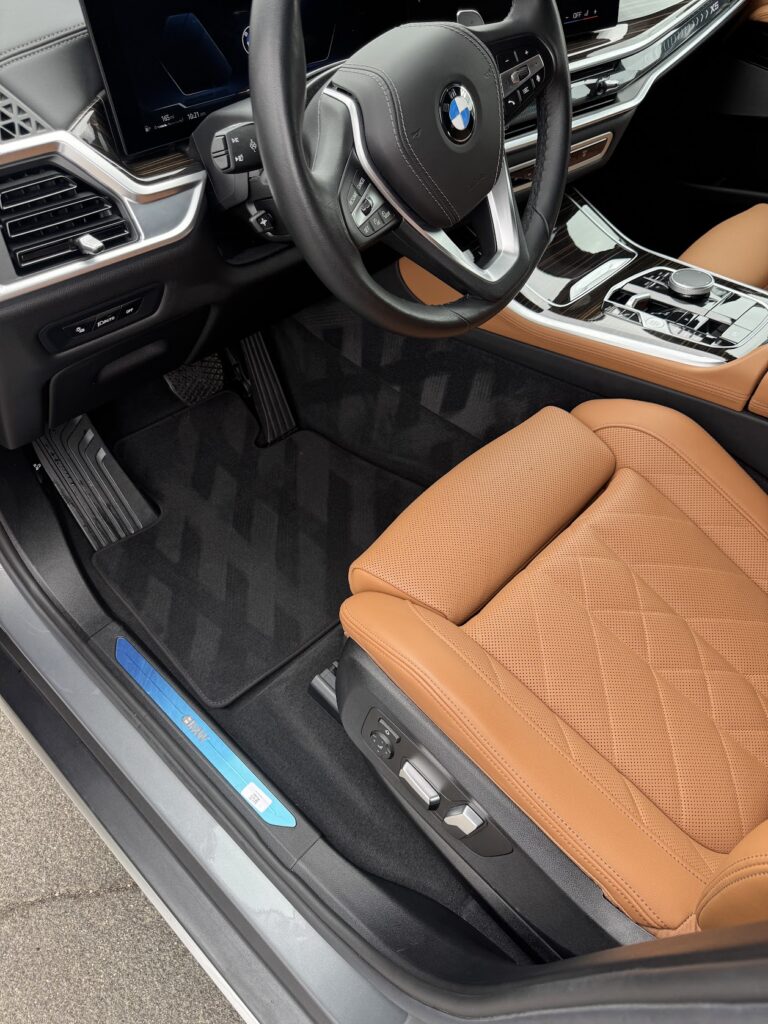 Tan leather BMW interior cleaned during a mobile maintenance wash