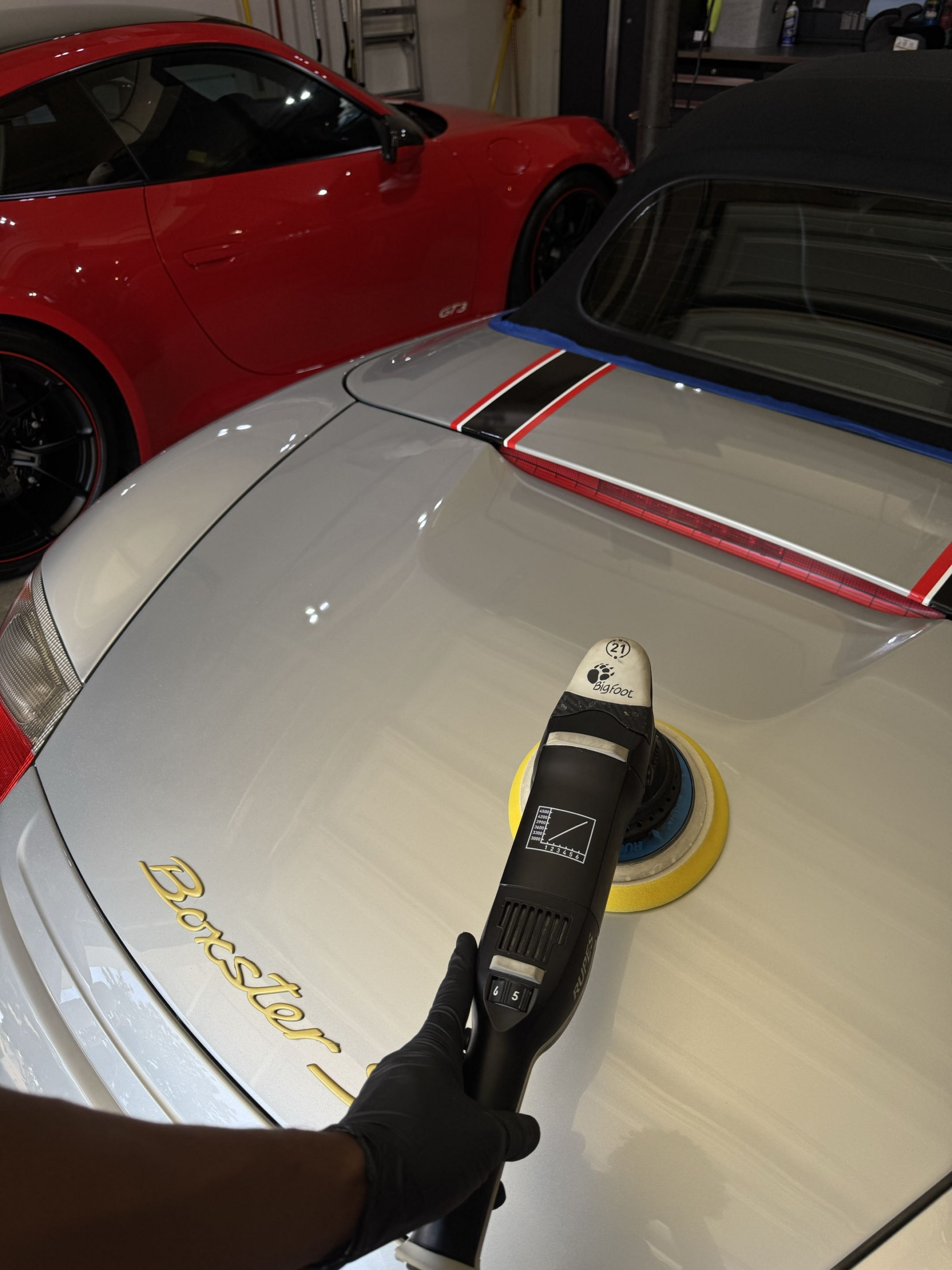 Machine polishing a panel during the paint correction stage of a ceramic coating job
