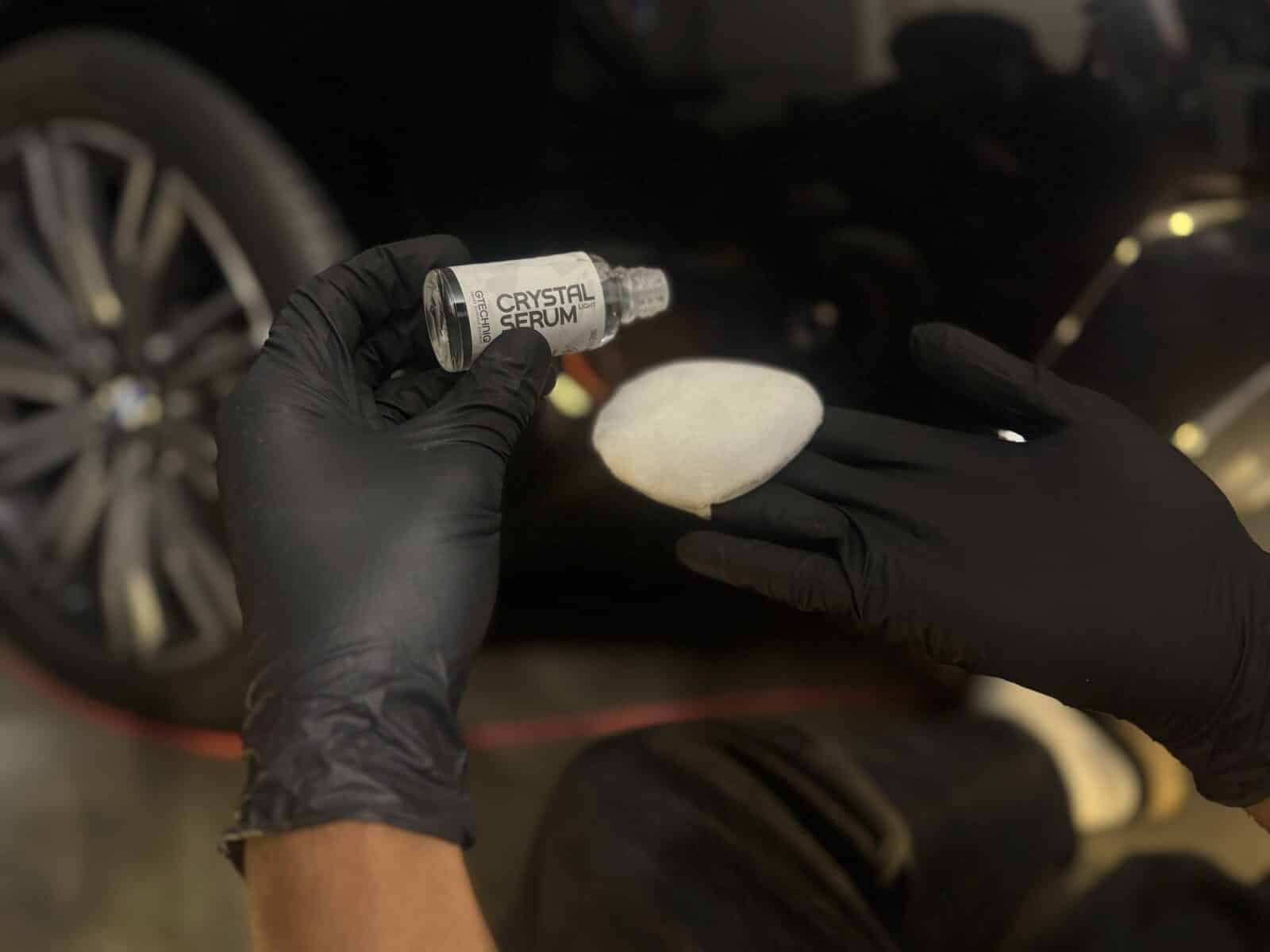 Ceramic coating being applied with an applicator