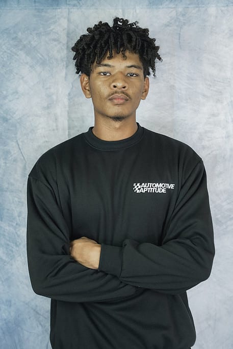 Jaycen, owner of Automotive Aptitude, who details cars in Lakewood